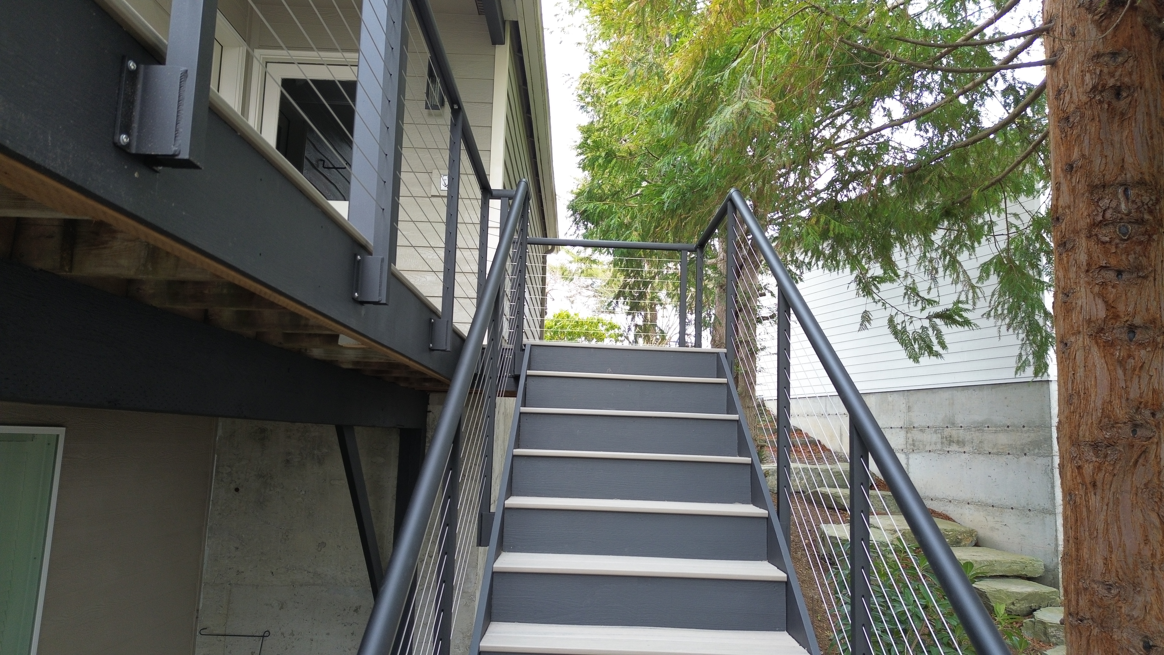 Innovative Aluminum cable railing along the walkway and down the stairway