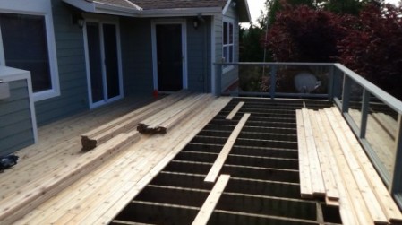 New Cedar Decking Being applied to the existing deck frame