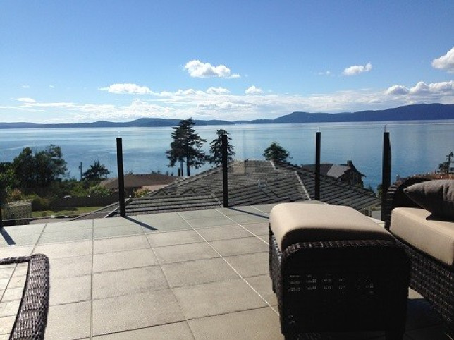Waterproof paver deck with topless glass infinity railing in Anacortes