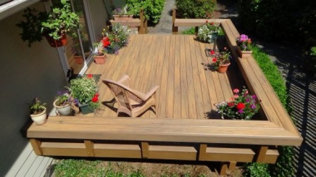 top view of deck with built in benches surface is Timbertech Legacy Tigerwood decking 