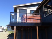 Aluminum and glass railing with black powder coated frame on a deck located in Anacortes, WA 98221
