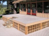Finished view of entry way from main deck. This view shows the stone steps and custom cedar lattice.